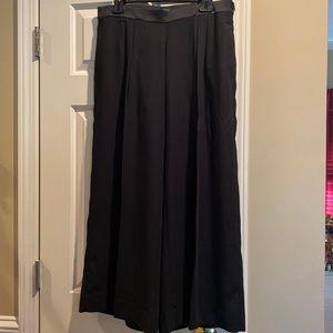 Once worn black wide-leg ankle length pleated pants with satin waist band.